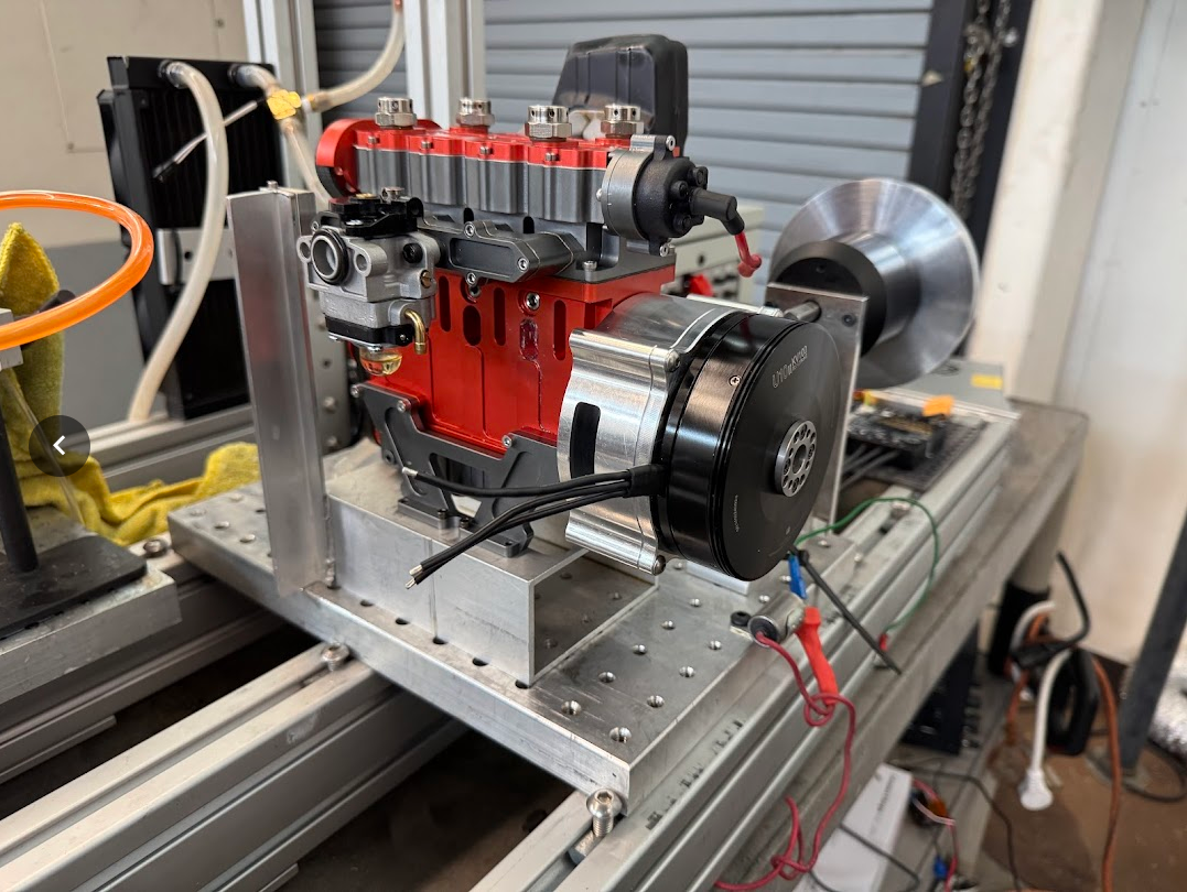 Hybrid System physical test rig showing the small inline 4 engine coupled to a brushless motor/generator.